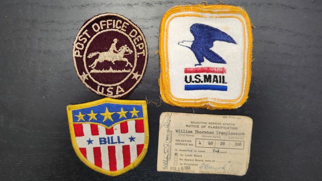 Post Office patches, and draft card.